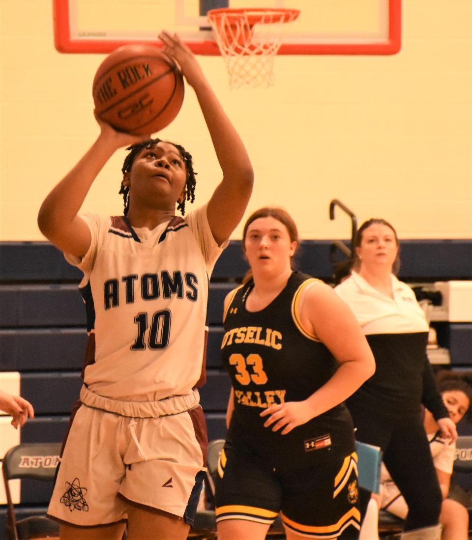 Somaria Holliman-Patterson (10) shoots for the Utica Academy of Science in front of Otselic Valley Viking Gracie Rooker during the fourth quarter of Wednesday's game.