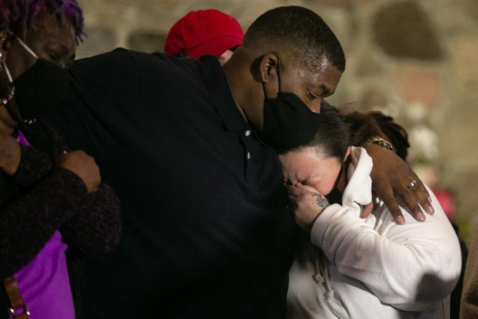 Aubrey and Katie Wright embrace while Katie cries.