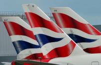 FILE PHOTO - British Airways logos are seen on tailfins at Heathrow Airport in west London, Britain May 12, 2011. REUTERS/Toby Melville/Files