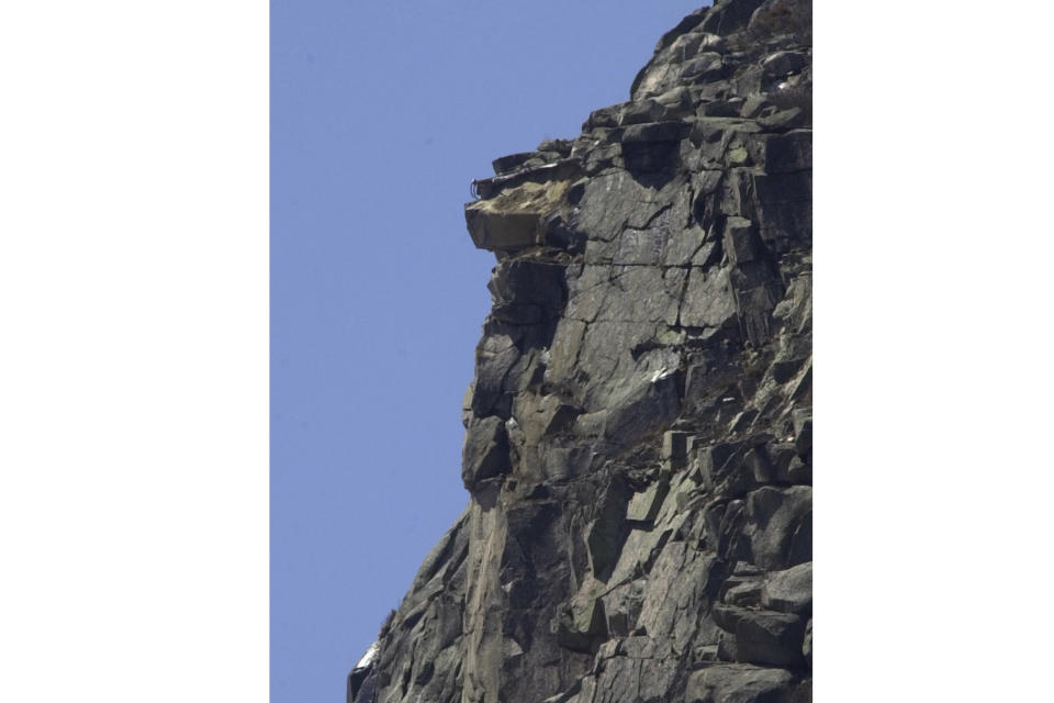 FILE - The side of Cannon Mountain in Fraconia, N.H, where the natural formation of the "Old Man of the Mountain" once was is seen on May 3, 2003. Two decades after New Hampshire’s famed Old Man of the Mountain crumbled to pieces, the state is paying tribute to the granite profile that symbolizes its independence and still adorns its license plates with new geological research, poetry, a song, and a scavenger hunt. (AP Photo/Jim Cole, File)