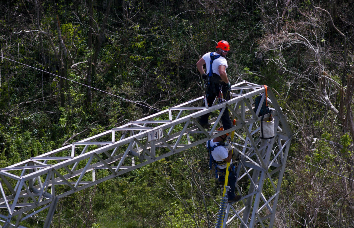 Whitefish Energy Holdings workers restore power lines damaged by Hurricane Maria in Barceloneta, Puerto Rico. The Federal Emergency Management Agency said Oct. 27 that it had no involvement in the decision to award a $300 million contract to help restore Puerto Rico’s power grid to a tiny Montana company in Interior Secretary Ryan Zinke’s hometown, Oct. 15, 2017. (Photo: Ramon Espinosa/AP)