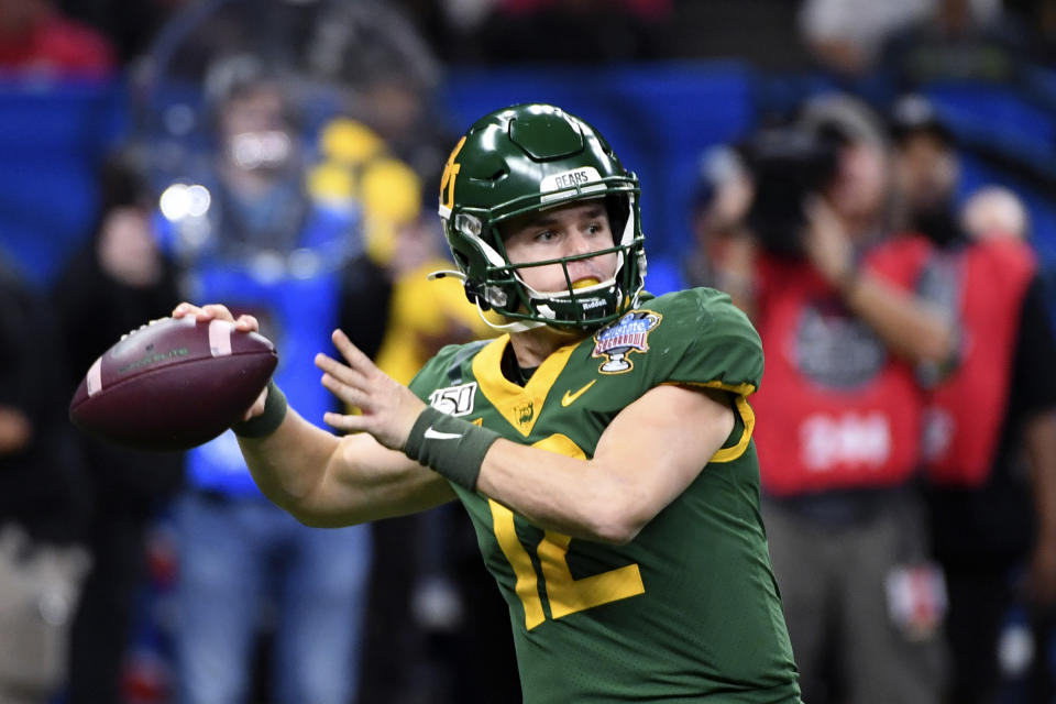 FILE - Baylor quarterback Charlie Brewer (12) passes in the first half of the Sugar Bowl NCAA college football game in New Orleans, Wednesday, Jan. 1, 2020. Brewer and Baylor took the Sooners to overtime in last year's title game, though the tough-minded quarterback didn't play after halftime following a hard hit he delivered on a defender on a running play before taking a hard sack. (AP Photo/Bill Feig, File)