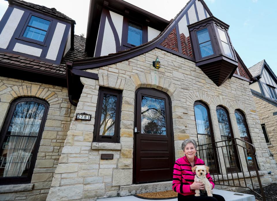 Anne Curley poses for a portrait Wednesday, March 16, 2022, at her home located on N. 71st St., Milwaukee.  “It was built in the 30’s, they just don’t make homes like this anymore,” she said. “It’s my dream home; when I come downstairs every morning I feel so happy. I am surrounded by beauty.”