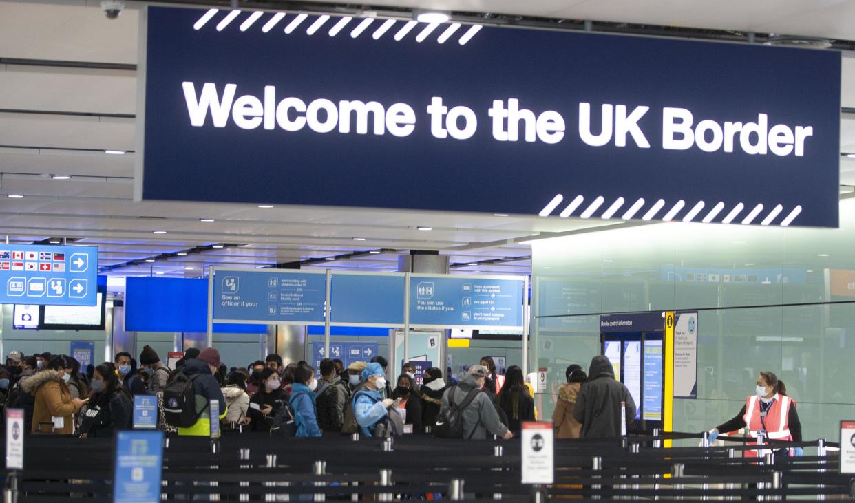 LONDON, ENGLAND - FEBRUARY 11: People queue at UK border control at Terminal 2 at Heathrow Airport on February 11, 2021 in London, England. (Photo by Ian Vogler - Pool/Getty Images)