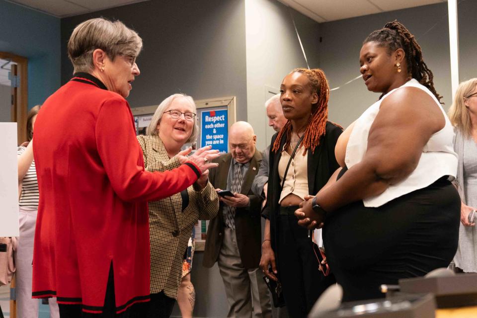 Gov. Laura Kelly, far left, speaks alongside DCF secretary Laura Howard with child welfare advocates with lived experience, from left, Sierra Jones and Alexandria Ware during Tuesday's ceremonial bill signing creating a SOUL family permanency option in the state.