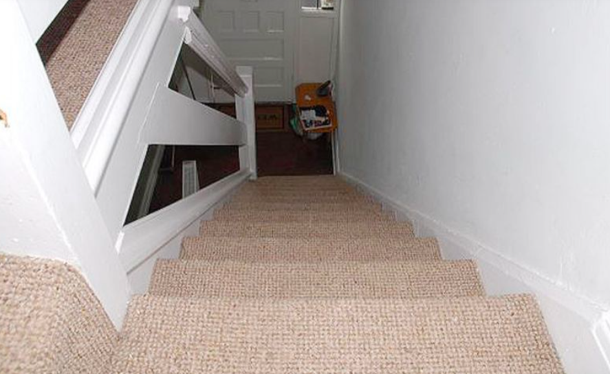 <em>Jurors were shown a photo of stairs at the property where the family lived (PA)</em>