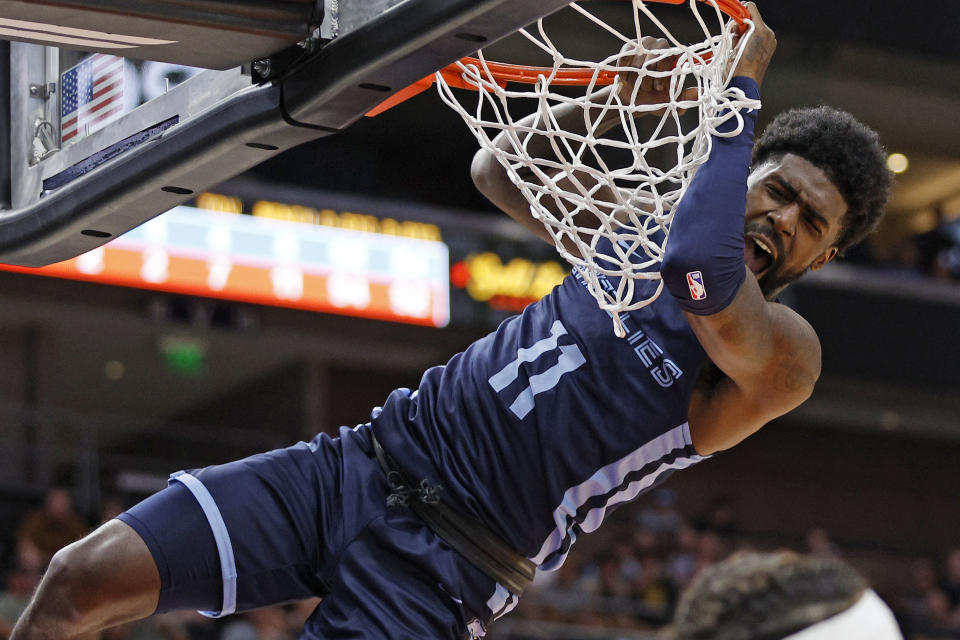 Memphis Grizzlies guard Shaq Buchanan reacts after a dunk against the Oklahoma City Thunder during the first half of an NBA summer league basketball game Wednesday, July 6, 2022, in Salt Lake City. (AP Photo/Jeff Swinger)