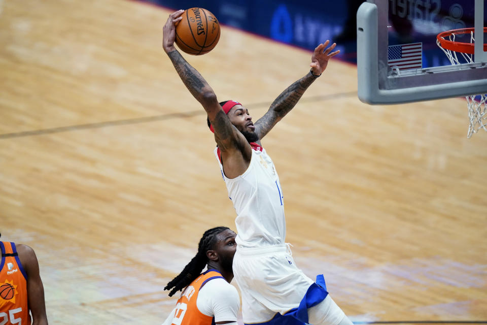 New Orleans Pelicans forward Brandon Ingram goes to the basket during the first half of the team's NBA basketball game against the Phoenix Suns in New Orleans, Friday, Feb. 19, 2021. (AP Photo/Gerald Herbert)