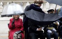 <p>Camilla reacts as anyone would when politician Bob Ainsworth failed to properly operate his umbrella.<br></p>