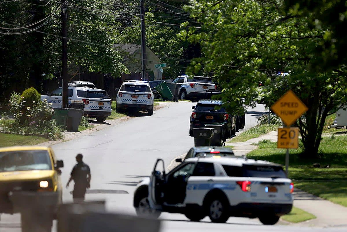 Police work at the scene of a shooting in Charlotte, North Carolina. ‘Numerous’ officers have been shot, police said Monday  (AP)