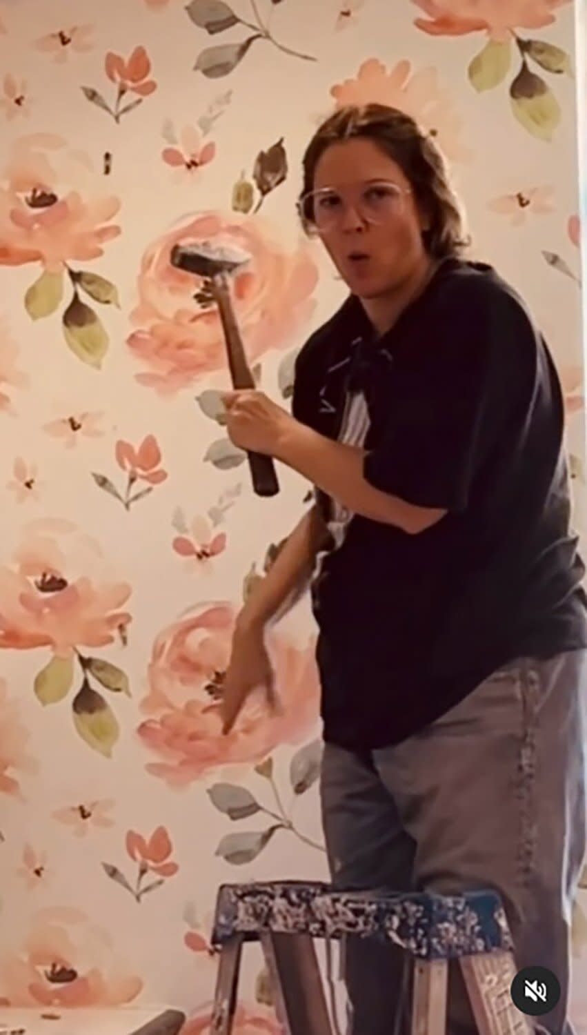 Drew Barrymore Destroys Apartment With Hammer in Home Makeover Video: 'Having the Time of My Life'  Tout taken from this video:  https://www.instagram.com/p/CfCOSroPaqV/