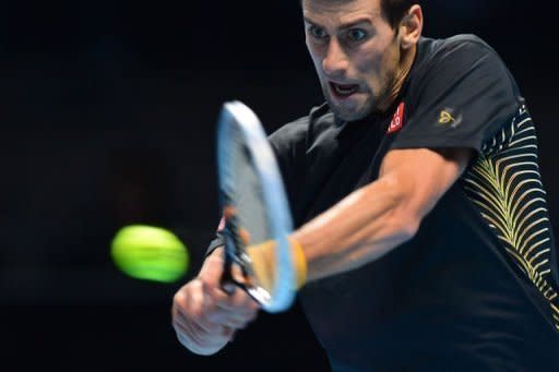 Serbia's Novak Djokovic returns against Switzerland's Roger Federer during the singles final on the eighth day of the ATP World Tour Finals tennis tournament in London. Djokovic produced a masterful display to end Federer's reign as ATP Tour Finals champion as the world number one swept to a 7-6 (8/6), 7-5 victory in the final