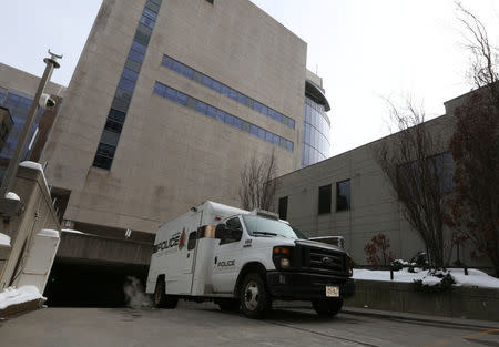 A police transport vehicle leaves the John Sopinka Courthouse, where Karim Baratov appeared in front of a judge in Hamilton, Ontario, Canada March 15, 2017 in connection with a U.S. Justice Department investigation into the 2014 hacking of Yahoo. REUTERS/Peter Power