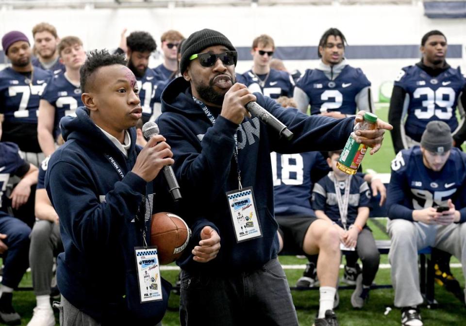 Tyshawn Jennings, 14, and Tim Jennings sing a Michael Jackson song to cheers from Penn State football players on Saturday, Feb. 17, 2024 in Holuba Hall.  