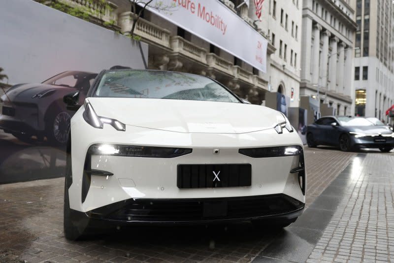 Vehicles from the Chinese EV maker Zeekr are on display before the opening bell at the entrance to the New York Stock Exchange on Wall Street in New York City on Friday. Zeekr is a potential Tesla competitor. Photo by John Angelillo/UPI