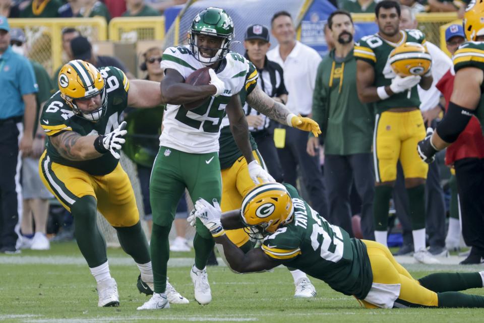 New York Jets' Brandin Echols returns an interception during the second half of a preseason NFL football game against the Green Bay Packers Saturday, Aug. 21, 2021, in Green Bay, Wis. (AP Photo/Mike Roemer)