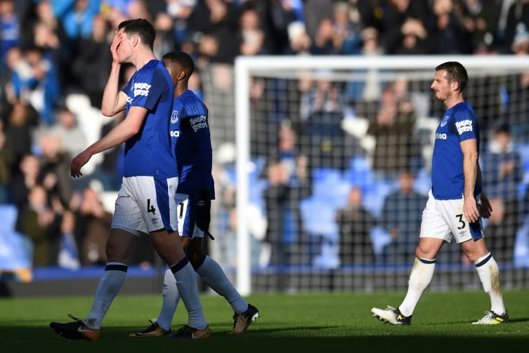 Everton's players leave the pitch disappointed at the end of their English Premier League match against Arsenal, at Goodison Park in Liverpool, on October 22, 2017