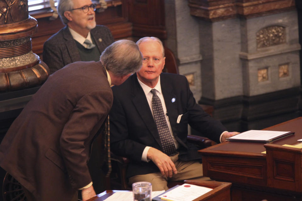 Kansas Senate Majority Leader Gene Suellentrop, right, R-Wichita, confers with Sen. Mike Thompson, R-Shawnee, during the Senate session Wednesday, March 17, 2021, at the Statehouse in Topeka, Kan. Suellentrop is stepping aside from most of the majority leader's duties following his arrest on suspicion of driving under the influence and attempting to flee law enforcement. (AP Photo/John Hanna)