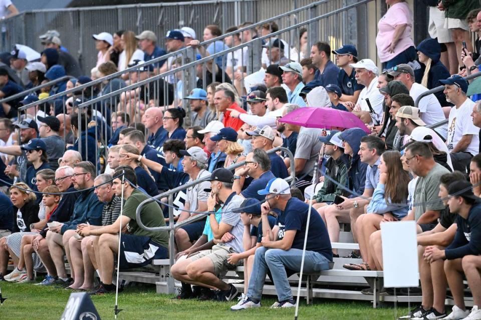 Fans sat through the rain to watch Penn State’s open football practice at the Lasch practice field Saturday, Aug. 12, 2023.