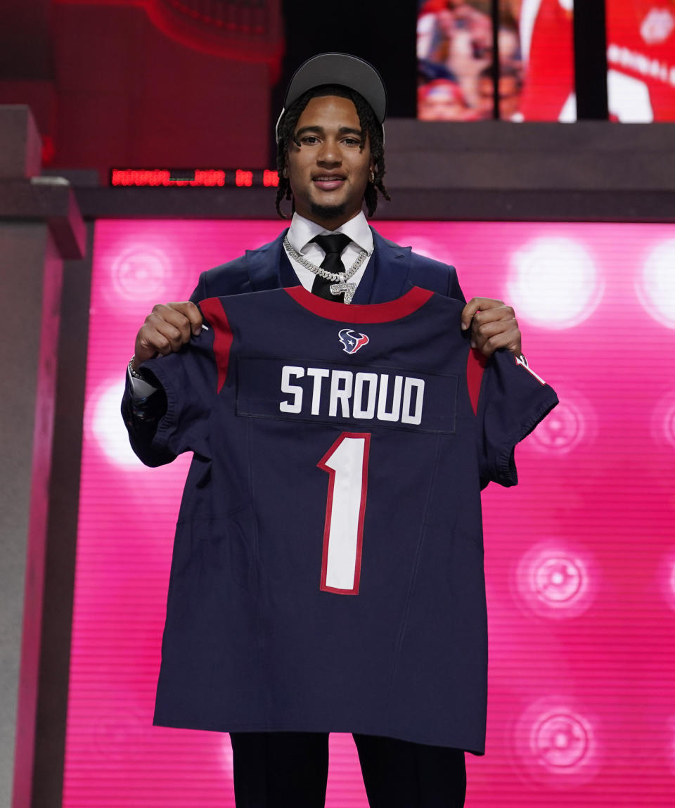 Ohio State quarterback C.J. Stroud poses after being chosen by the Houston Texans with the second overall pick during the first round of the NFL football draft, Thursday, April 27, 2023, in Kansas City, Mo. (AP Photo/Jeff Roberson)