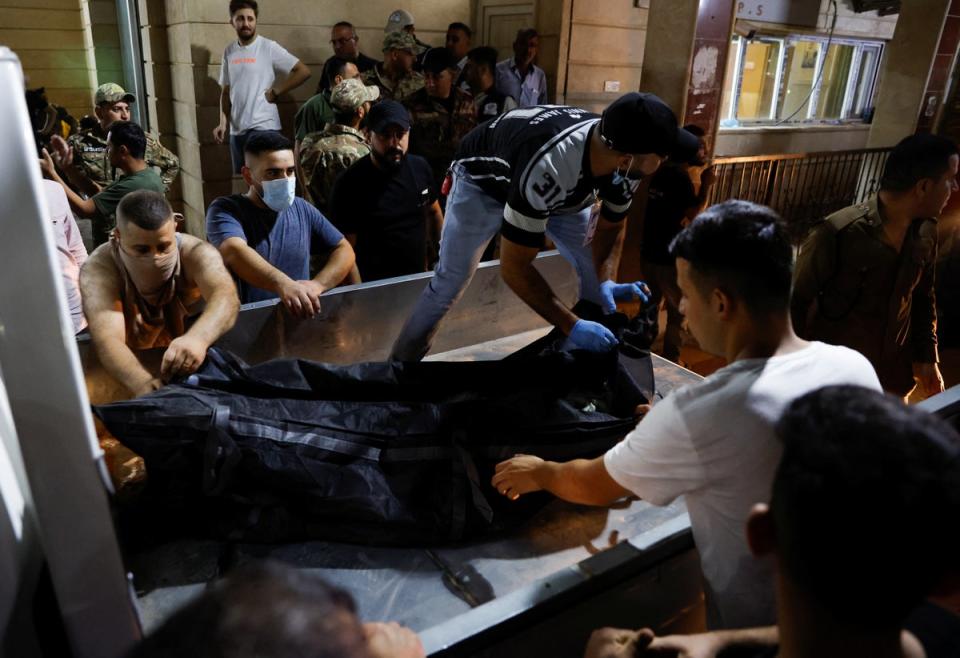 Survivors were pulled from the hall and taken to hospital on Tuesday night (REUTERS/Khalid Al-Mousily)