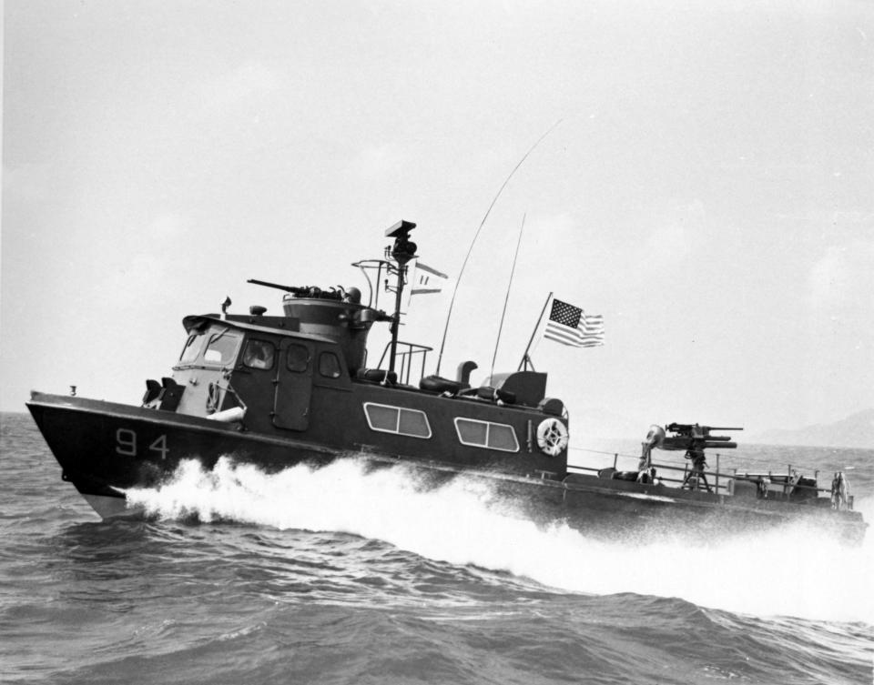 This early configuration Swift Boat is pictured in the South China Sea. It was adapted from an offshore oil rig crew boat used in the Gulf of Mexico. Two diesel engines powered this 50-foot-long craft. Its shallow draft allowed it to get close to shore and into smaller canals.