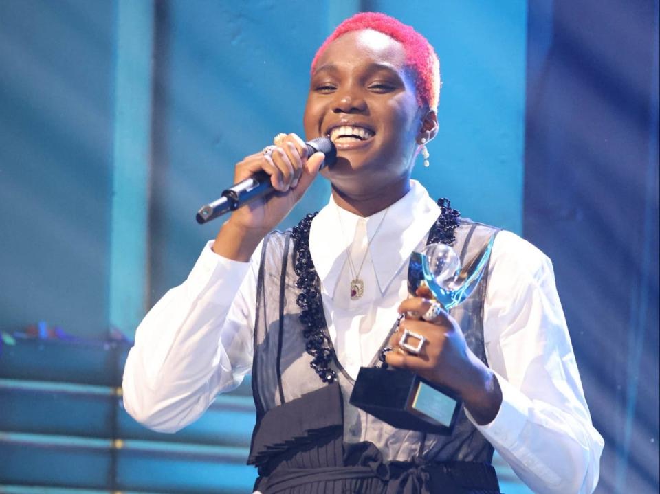 Arlo Parks with her trophy for the 2021 Mercury Prize (PA)