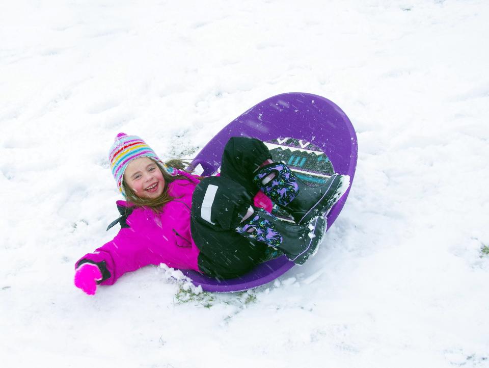 Bobbie Maguire, 5, of Easton has a blast sledding on the hill at a local park during the snowstorm on Tuesday, Feb. 13, 2024.