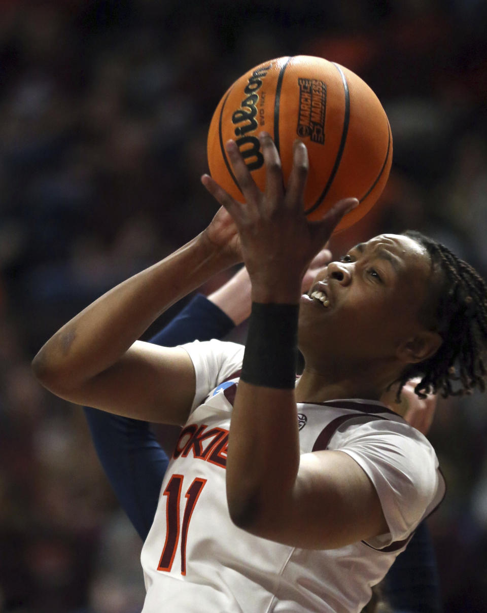 Virginia Tech's D'asia Gregg (11) grabs a defensive rebound during the first quarter of the team's first-round college basketball game against Chattanooga in the women's NCAA Tournament, Friday, March 17, 2023, in Blacksburg, Va. (Matt Gentry=varoa=-