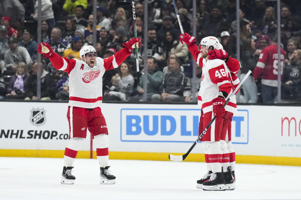 Detroit Red Wings left wing David Perron, left, celebrates a goal by defenseman Jeff Petry, right, against the Los Angeles Kings during the second period of an NHL hockey game Thursday, Jan. 4, 2024, in Los Angeles. (AP Photo/Jae C. Hong)