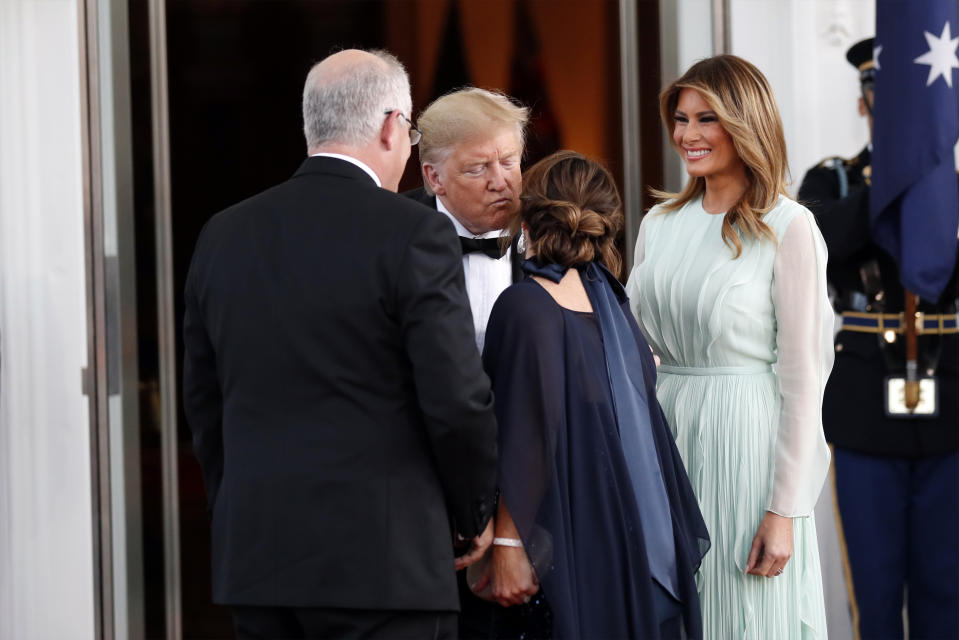 President Donald Trump and first lady Melania Trump greet Australian Prime Minister Scott Morrison and his wife Jenny Morrison as they arrive for a State Dinner at the White House, Friday, Sept. 20, 2019, in Washington. (AP Photo/Alex Brandon)