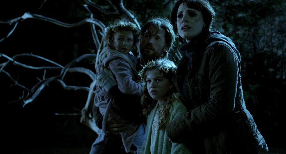 This film image released by Universal Pictures shows, from left, Isabelle Nélisse, Nikolaj Coster-Waldau, Megan Charpentier and Jessica Chastain in a scene from "Mama." (AP Photo/Universal Pictures)