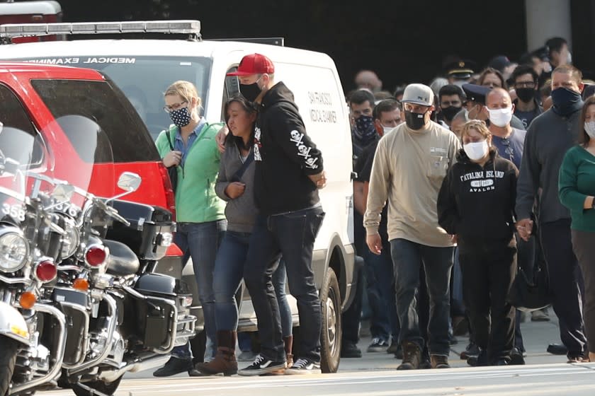 SAN FRANCISCO, CA - OCT. 7: Family and friends of deceased SF firefighter and paramedic Jason Cortez head to SFFD vehicles for a procession to Medical Examiner's office from SF General Hospital in San Francisco, Calif., on Wednesday, October 7, 2020. Cortez died Wednesday morning during a training exercise. (Scott Strazzante/The San Francisco Chronicle via Getty Images)