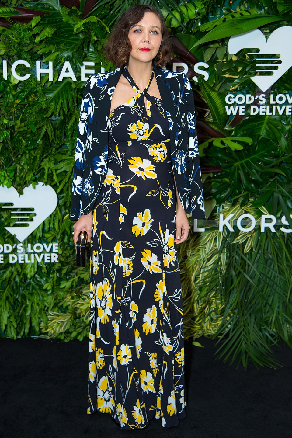 <p><strong>16 October </strong>Maggie Gyllenhaal clashed patterns wearing a Michael Kors floral dress with a navy floral bomber jacket. </p>