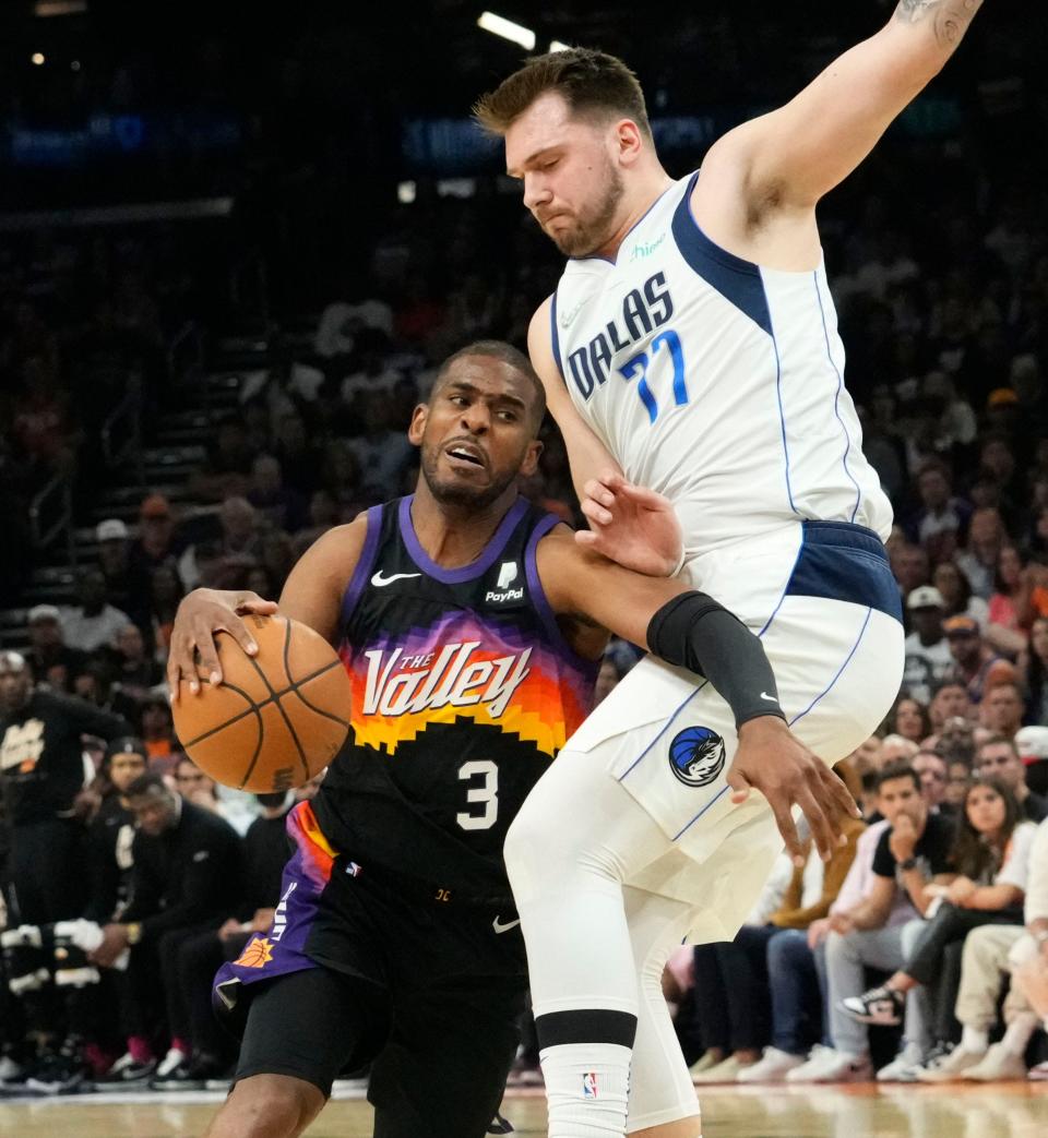May 15, 2022; Phoenix, Arizona, USA; Phoenix Suns guard Chris Paul (3) is pressured by Dallas Mavericks guard Luka Doncic (77) during game seven of the second round for the 2022 NBA playoffs at Footprint Center.