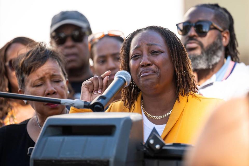 Elysse Versher, a former assistant principal at West Campus High School, speaks emotionally at rally at the state Capitol on Wednesday about racist treatment at the school. She is filing a lawsuit against the school district.