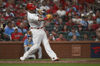 St. Louis Cardinals ' Yadier Molina hits an RBI single against the Milwaukee Brewers during the second inning of a baseball game Wednesday Sept. 14, 2022, in St. Louis. (AP Photo/Joe Puetz)