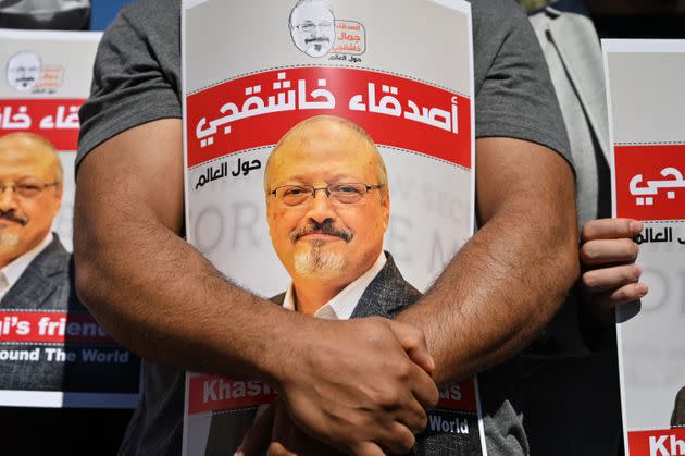 Friends of murdered Saudi journalist Jamal Khashoggi hold posters bearing his picture as they attend an event marking the second-year anniversary of his assassination in front of Saudi Arabia Istanbul Consulate in 2020. (Photo: OZAN KOSE via Getty Images)