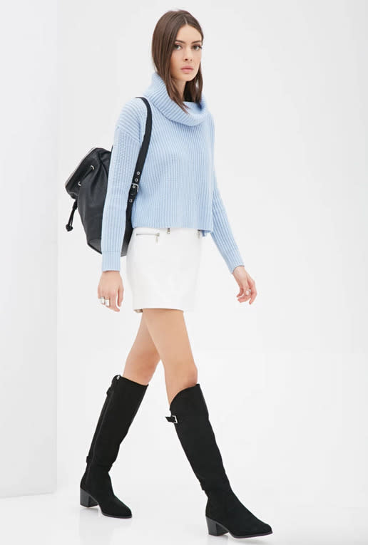 The combination of a cropped turtleneck with an A-line skirt creates a modern take on mod.