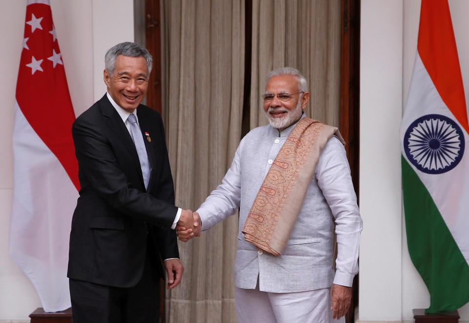 Singapore Prime Minister Lee Hsien Loong and his Indian counterpart Narendra Modi shake hands during a photo opportunity ahead of their meeting at Hyderabad House in New Delhi, India, January 25, 2018. (PHOTO: Adnan Abidi/Reuters)