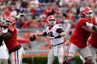 Georgia quarterback JT Daniels (18) throws from the pocket during the first half in Georgia's spring NCAA college football game, Saturday, April 17, 2021, in Athens, Ga. (AP Photo/John Bazemore)