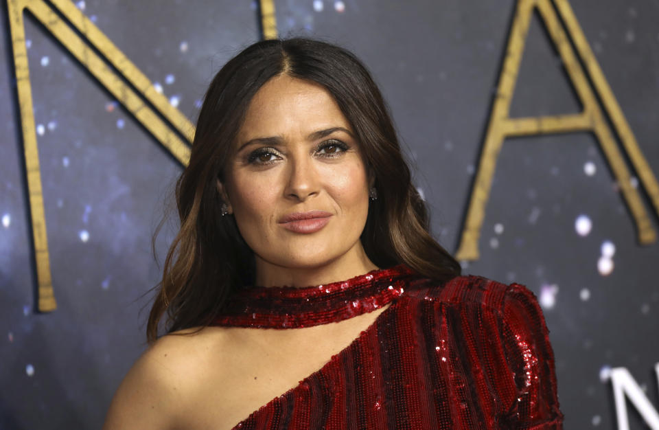 Salma Hayek poses for photographers upon arrival at the premiere of the film 'Eternals' on Wednesday, Oct. 27, 2021 in London. (Photo by Vianney Le Caer/Invision/AP)