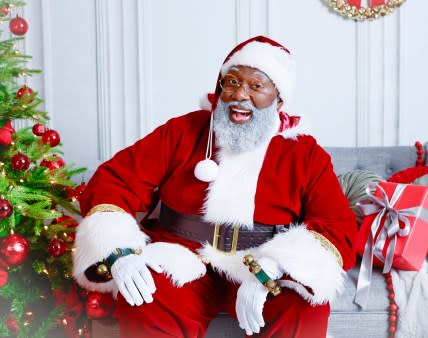 Black Santa, The Black Santa Houston, Black Santa Claus performer, professional Black Santa, Black Christmas characters, Black Christmas family pajamas, 25 Days of Holiday, Magan Butler-Coleman, Kelvin Douglas, theGrio.com