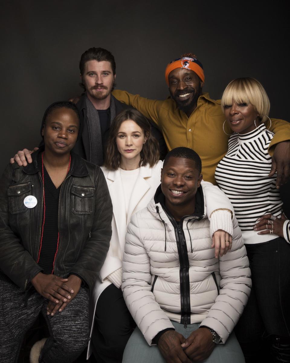 Director Dee Rees, from left, actors Garrett Hedlund, Rob Morgan, Mary J. Blige, Carrey Mulligan, center, and Jason Mitchell, bottom pose for a portrait to promote the film, "Mudbound", at the Music Lodge during the Sundance Film Festival on Saturday, Jan. 21, 2017, in Park City, Utah. (Photo by Taylor Jewell/Invision/AP)