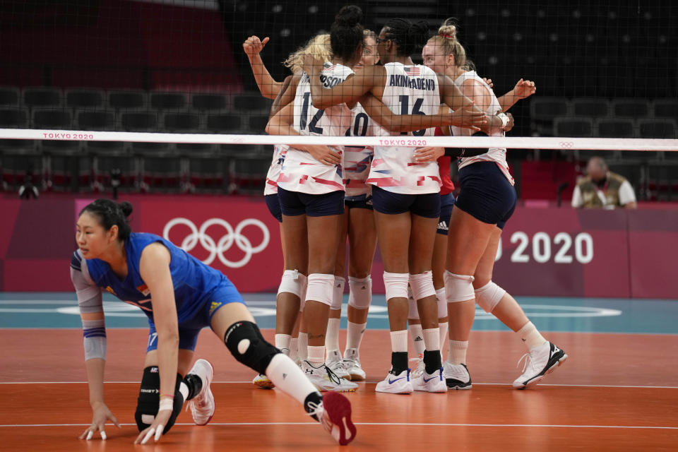 United States teammates celebrate during the women's volleyball preliminary round pool B match between China and United States at the 2020 Summer Olympics, Tuesday, July 27, 2021, in Tokyo, Japan. (AP Photo/Frank Augstein)