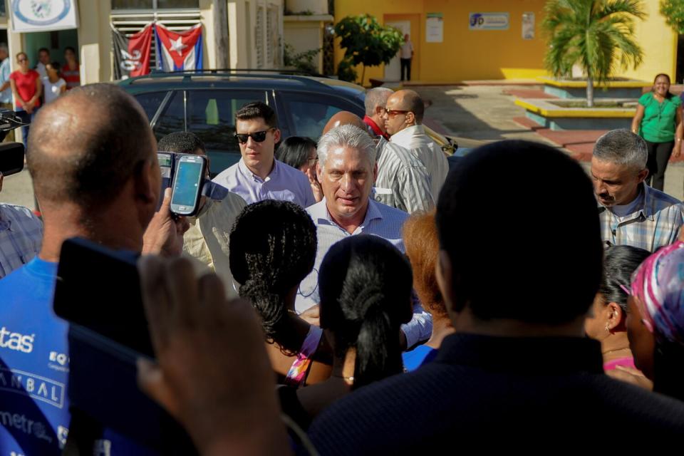 Cuban President Miguel Diaz-Canel visits with residents