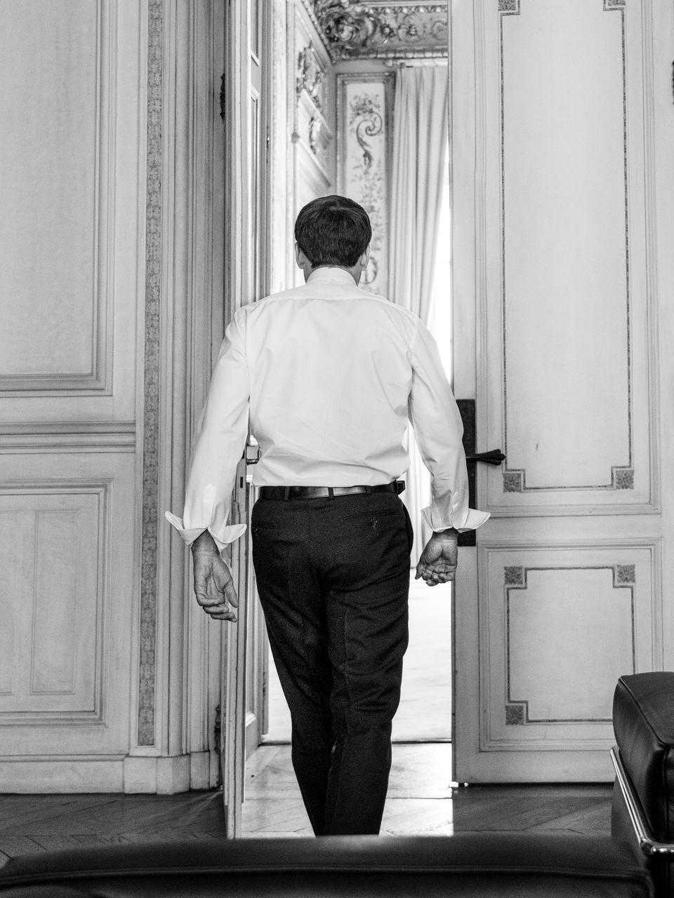 Macron steps out of a high-level meeting in the Élysée Palace in Paris on Sept. 9 | Christopher Anderson—Magnum Photos for TIME