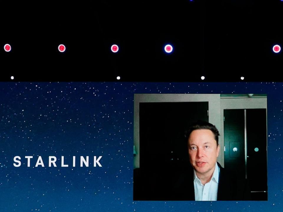 SpaceX founder Elon Musk on a video stage speaking about Starlink