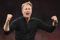 Denmark's manager Kasper Hjulmand celebrates after the Euro 2020 soccer championship group B match between Russia and Denmark at the Parken stadium in Copenhagen, Denmark, Monday, June 21, 2021. Denmark won 4-1. (Stuart Franklin/Pool via AP)