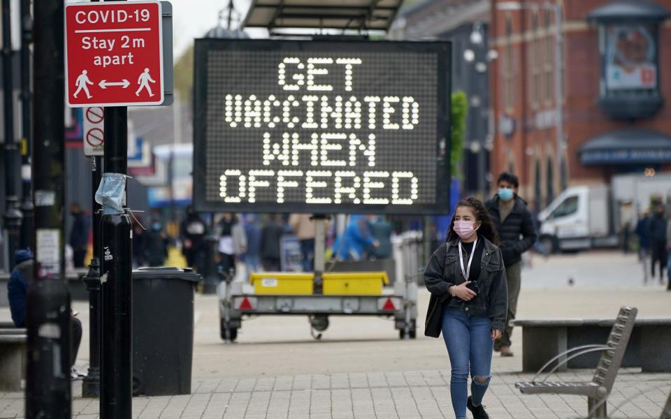 Coronavirus signs in Bolton town centre in Bolton, England, which is one of the eight areas experiencing a spike in cases - Christopher Furlong/Getty Images